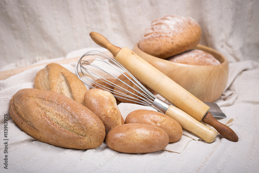 Fresh homemade bread in a cotton cloth background