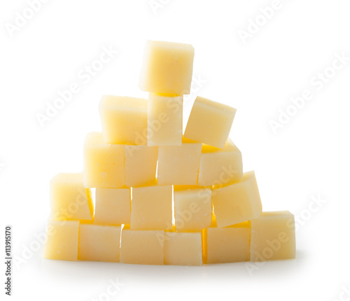 Parmesan cheese cubes on a white background with clipping path. Pyramid.