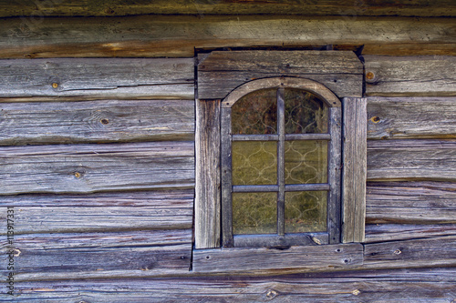 window in the old wooden blue house