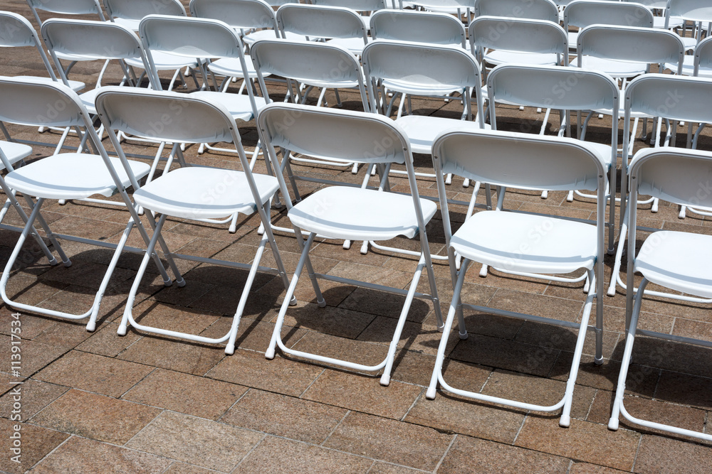 Fototapeta premium rows of folding chairs at event