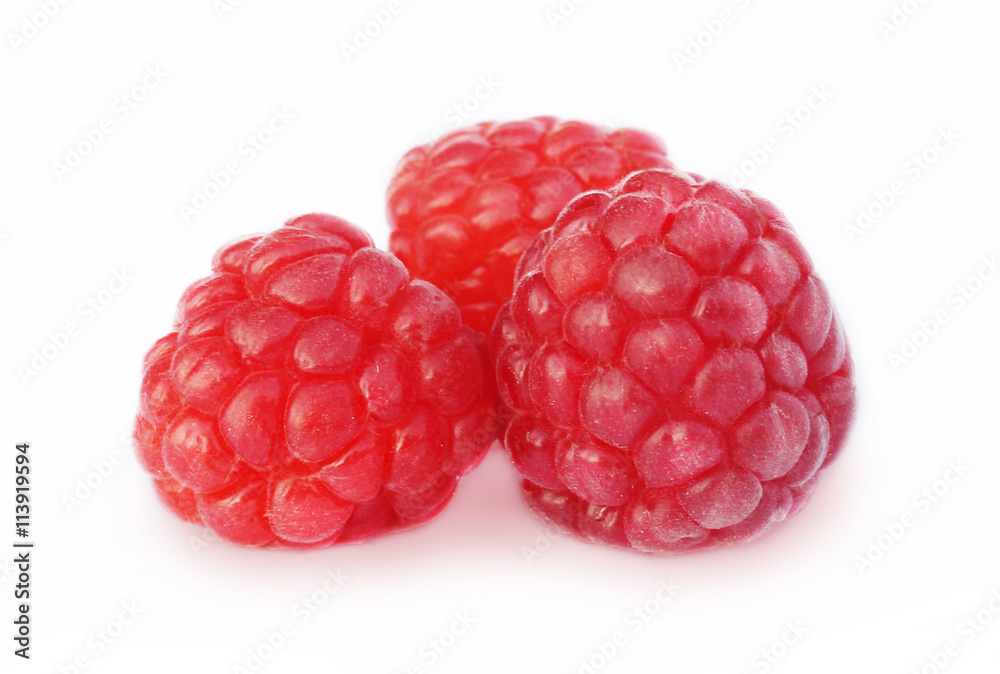 Three juicy raspberries on a white background Three juicy raspberries on a white background