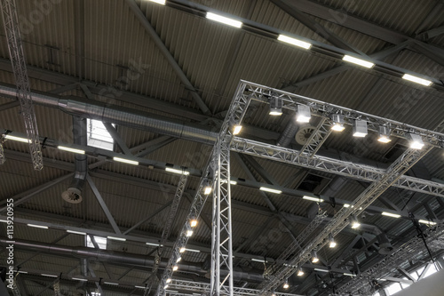 Ceiling of the room with a metal construction and ventilation