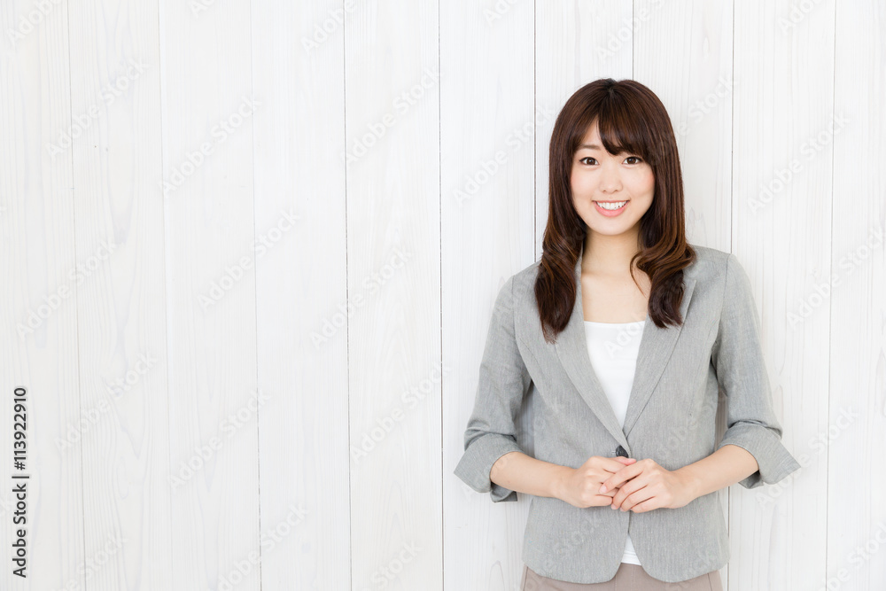 portrait of asian businesswoman on wood background