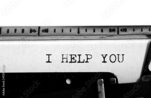 Typewriter. Typing text: i help you