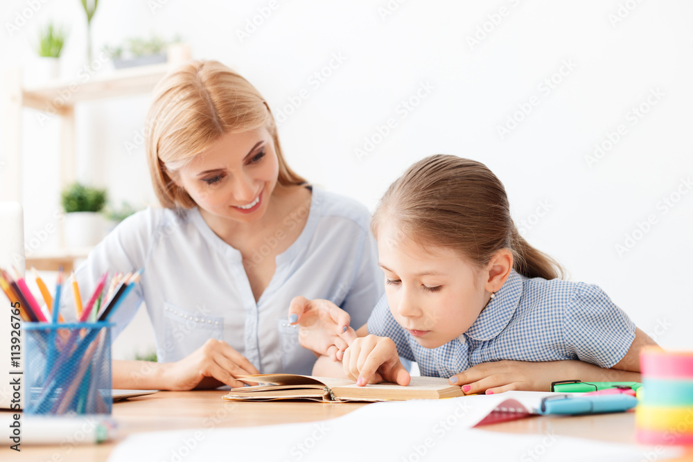 Little girl reading book