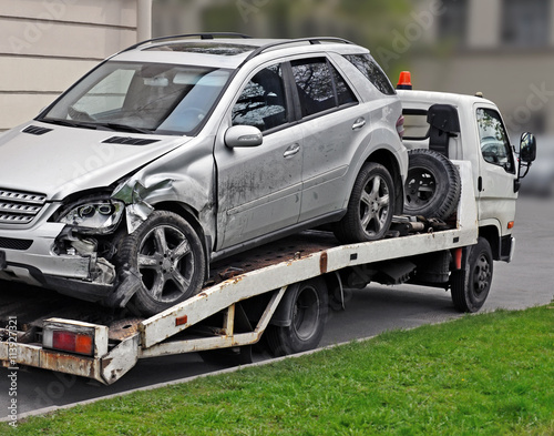 Fragment of tow truck which is taking away  faulty car