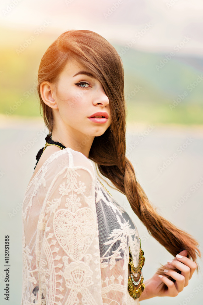 Gorgeous young woman with long hair on the beach in summer Stock Photo ...