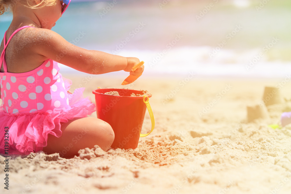 little girl play with sand on beach little girl play with sand on beach