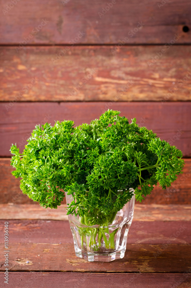 Fresh organic green curly parsley in a glass Fresh organic green curly parsley in a glass