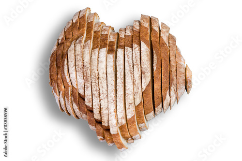 Sliced bread in shape of heart over white
