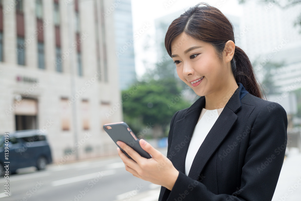 Asian Businesswoman looking at mobile phone