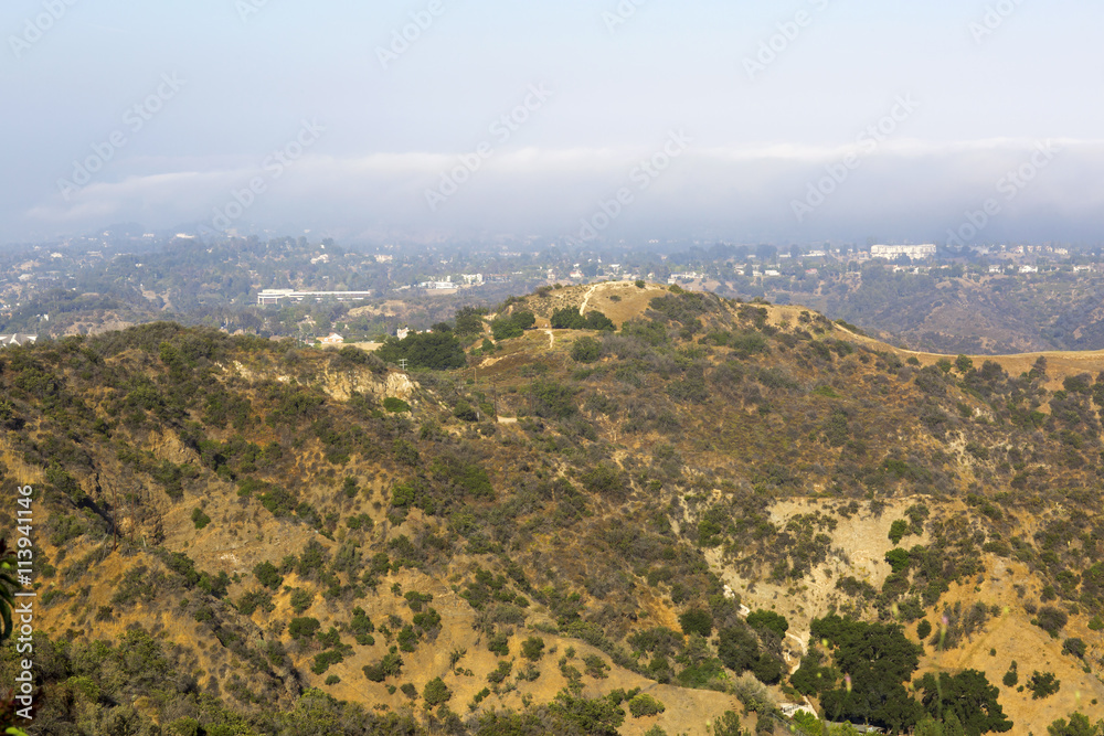 The mountains and hills near Los Angeles (USA). The mountainous landscape. The little houses in the mountains.