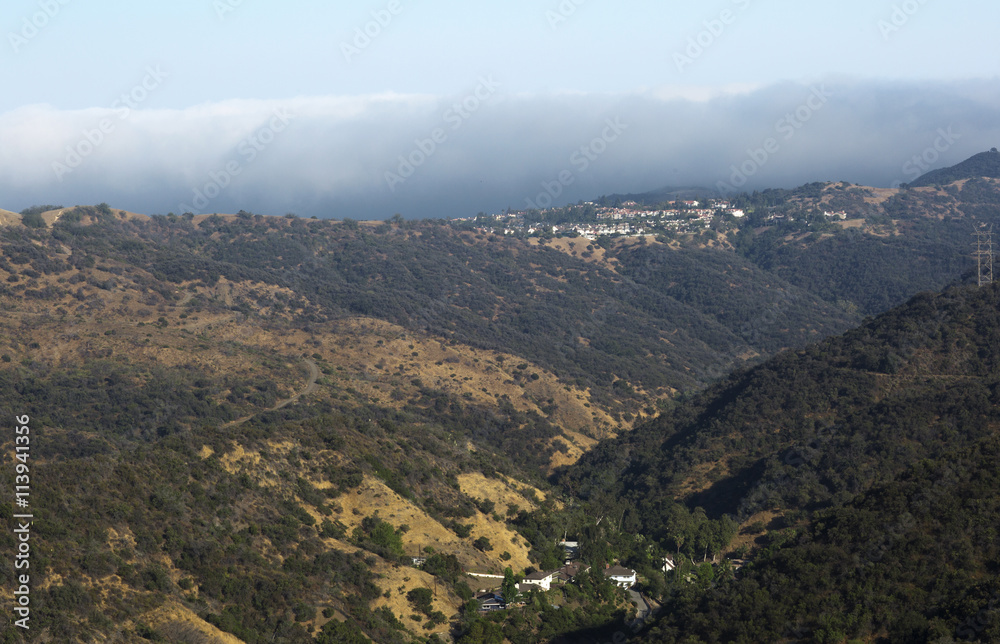 The mountains and hills near Los Angeles (USA). The mountainous landscape. The little houses in the mountains.
