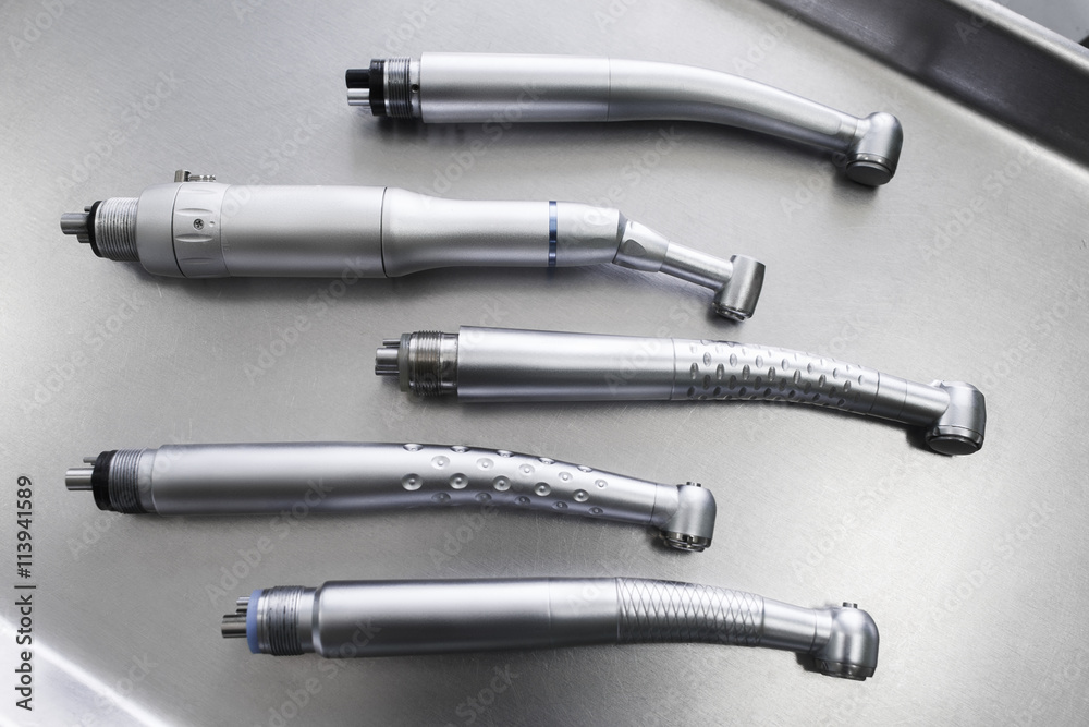 Set of dental turbine handpieces without burs flat lay. Top view on set