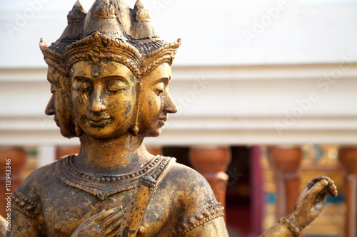Hindu god Brahma gold shabby old statue in Thailand