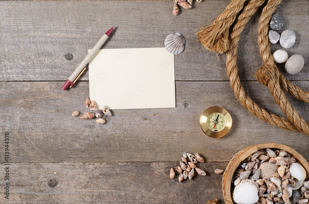 Travel items on wooden table. Notebook blank page mock-up Travel items on wooden table. Notebook blank page mock-up