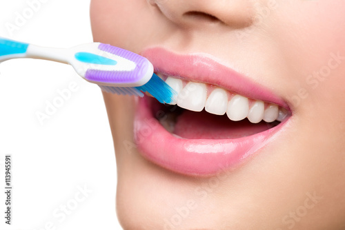 Teeth brushing. Beautiful white healthy teeth