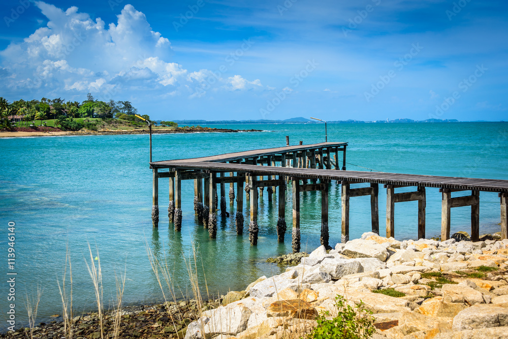 The tropical sea with wooden bridge in Thailand