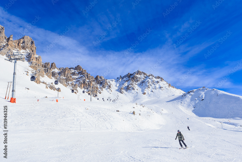Skier on the slopes of the ski resort of Meribel, France