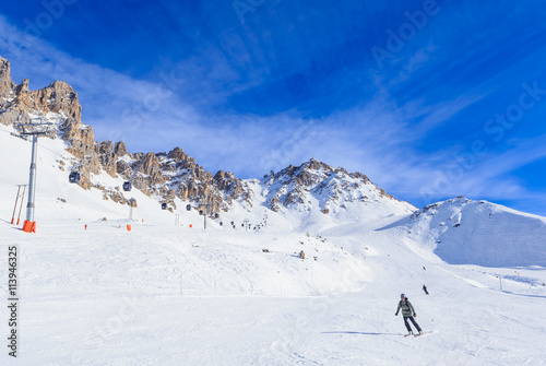 Skier on the slopes of the ski resort of Meribel, France