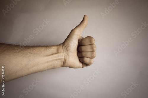 Human hand on vintage background to express success