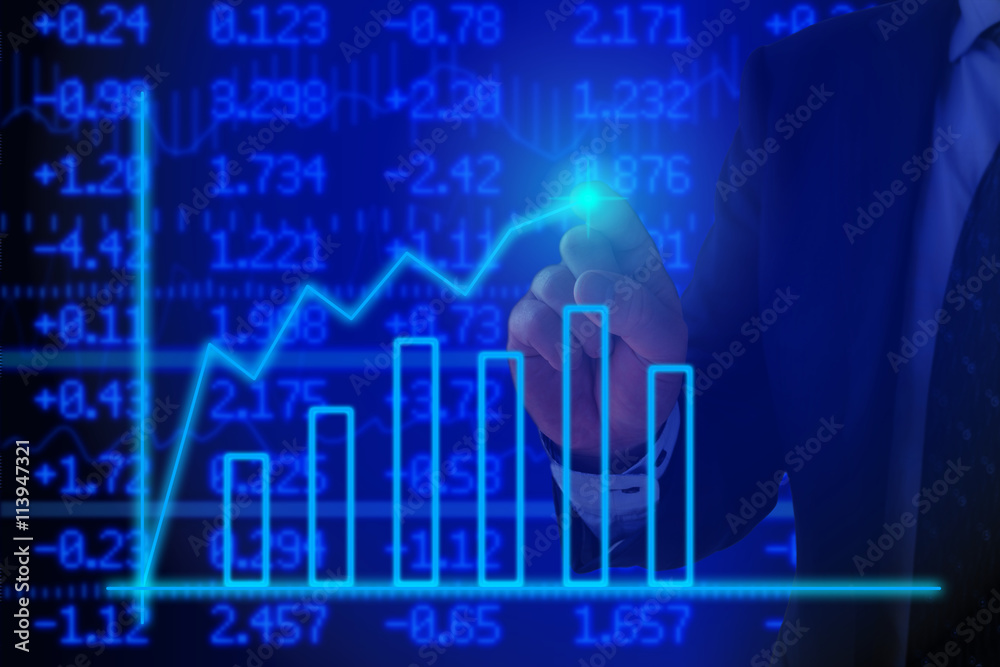 Businessman pressing a glowing chart Businessman pressing a glowing chart