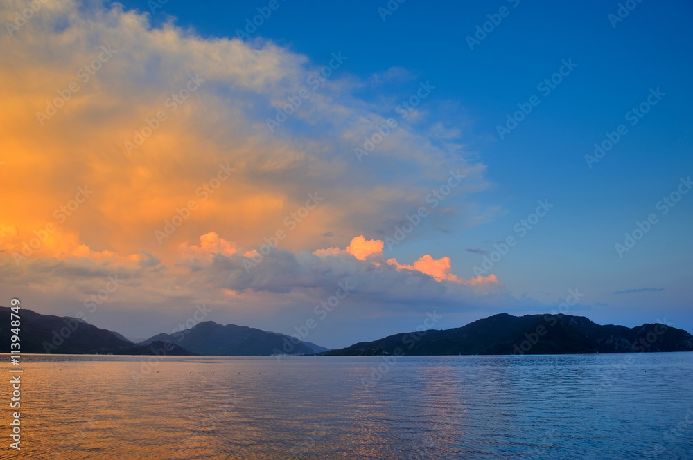 Beautiful seascape with mountains in the background. Sunset