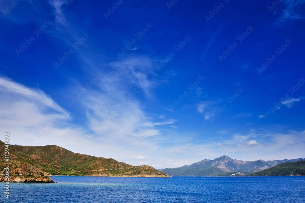 Aegean sea landscape view of water and cliff mountains