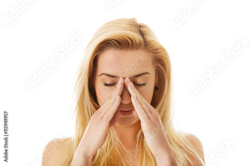 Woman with sinus pressure pain. photo