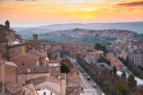 Small Italian town Fermo under brignt morning sky photo