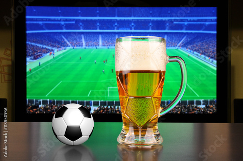 Pint of beer and soccer ball