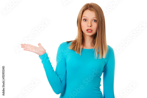 Surprised woman presenting something on palm