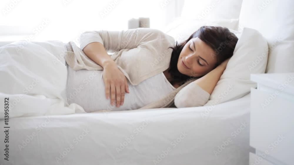 happy pregnant woman touching her tummy at home 13 happy pregnant woman touching her tummy at home 13