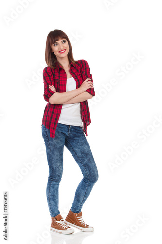Smiling Girl In Lumberjack Shirt With Arms Crossed