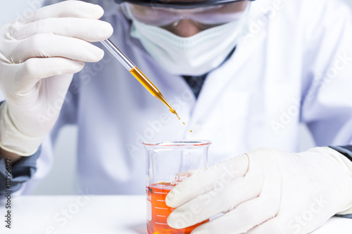 Sciencetist: Researcher Holding at a Liquid Solution on Isolated