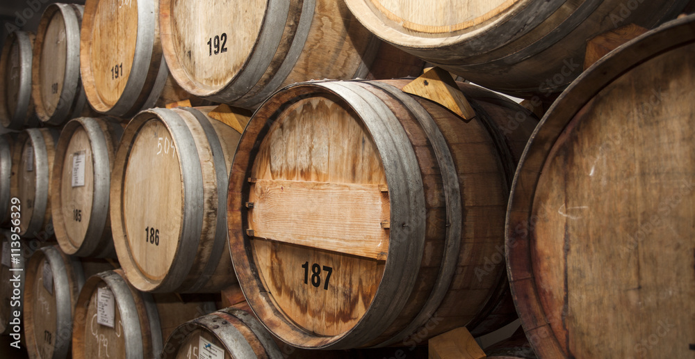 Wine barrels in cellar.