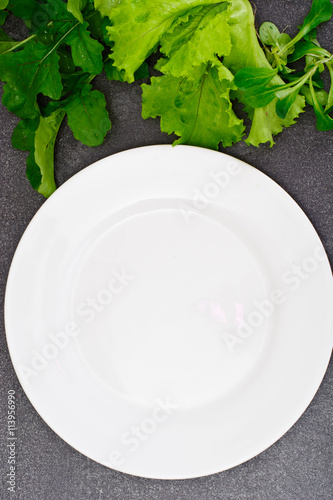 Fresh Spring Vegetables, Greens and Empty White Plate with Place