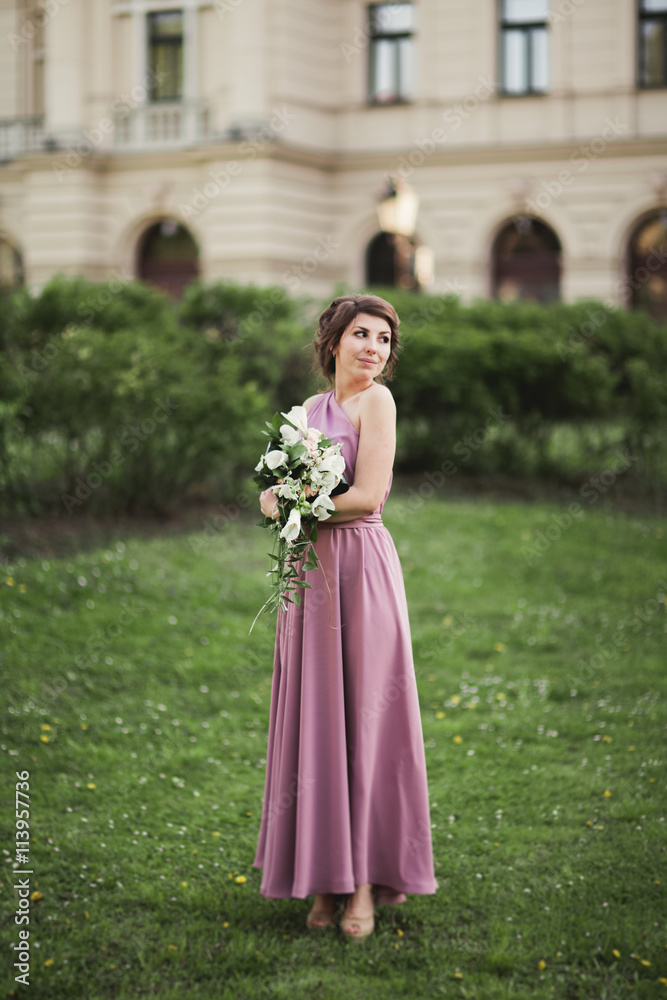 The beautiful woman, bride in pink dress with great bouquet The beautiful woman, bride in pink dress with great bouquet