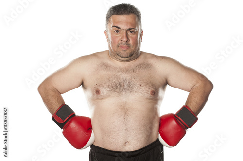 serious frown fat man with boxing gloves