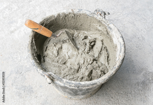 Pick up a trowel and cement mix concrete is compacted sand
