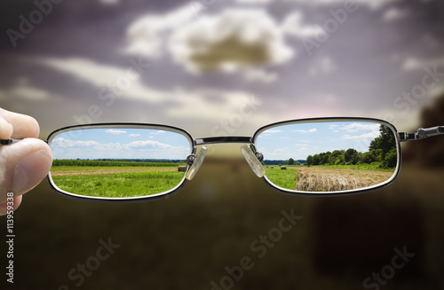 concept looking through glasses turns a gloomy day into a sunny one