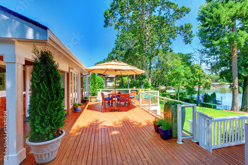 Sitting room area on spacious walkout deck overlooking water view.