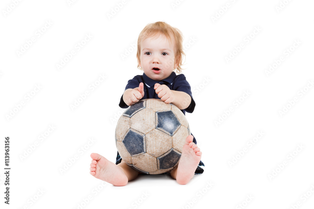 Baby boy playing with a soccer ball. Isolated on white Baby boy playing with a soccer ball. Isolated on white