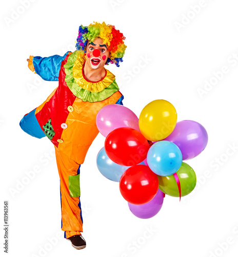 Happy birthday clown holding bunch of balloons and shows clown . Isolated.