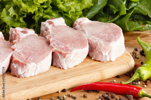 Raw steak with vegetables, ...