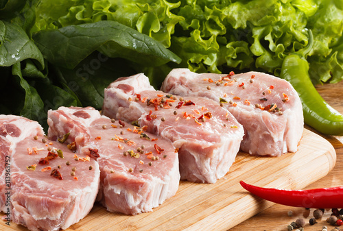 Raw steak with vegetables, ...