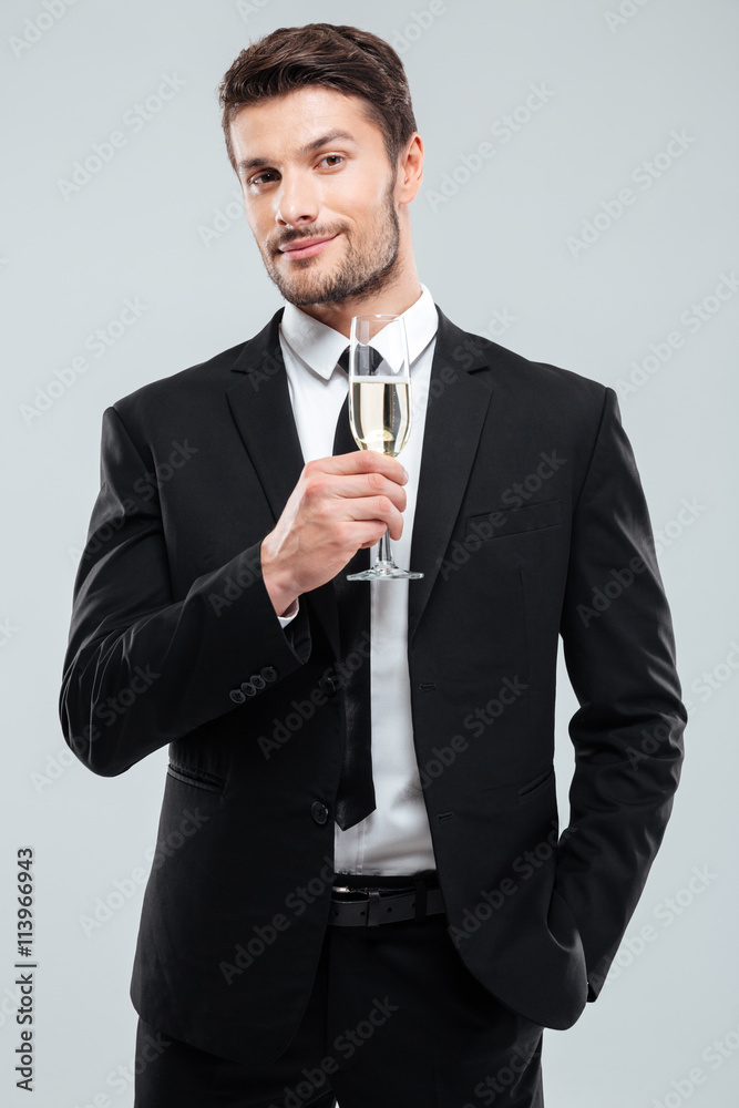 Businessman in suit and tie with glass of champagne Businessman in suit and tie with glass of champagne