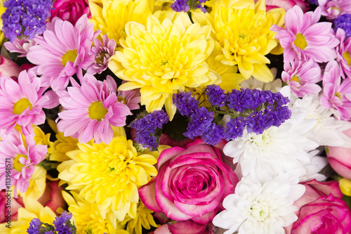 Colorful flower background of roses, chrysanthemums and limonium
