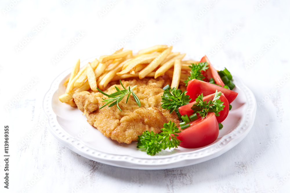 Wiener Schnitzel with French Fires and Tomatoes Wiener Schnitzel with French Fires and Tomatoes
