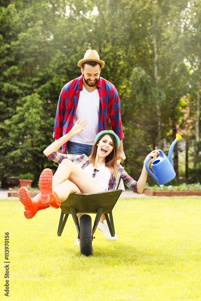 Fotografie Young couple having fun in the barrow